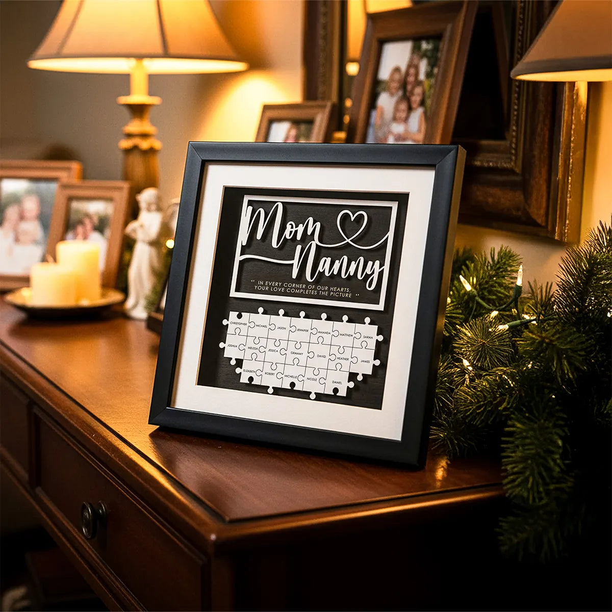 Framed personalized wooden grandma puzzle with Mom and Nanny text and family name pieces on a cozy console table with candles and photos, Christmas gift by ASC Gifts