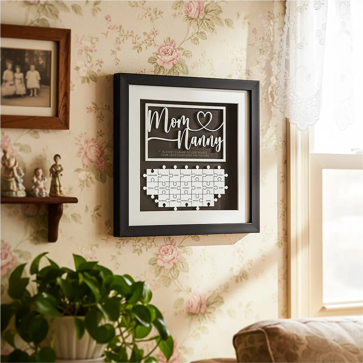 Framed personalized wooden grandma puzzle with Mom and Nanny text and family name pieces on a cozy console table with candles and photos, Christmas gift by ASC Gifts
